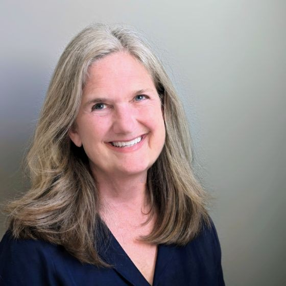 Heather Bussing, Employment Attorney at Salary.com seen with a bright smile on her face